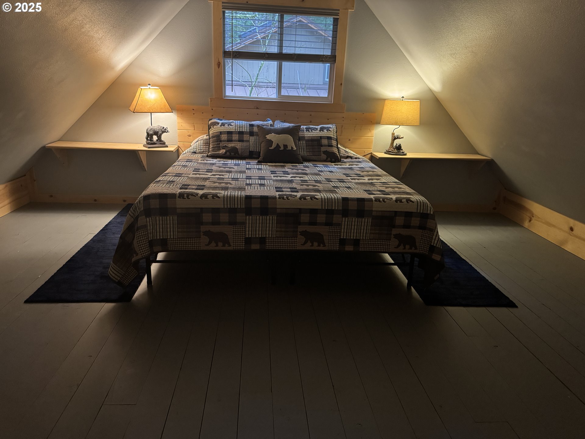 157 Northwoods Cougar, WA 98616 - Photo 24 of 27 a bedroom with a bed and a lamp