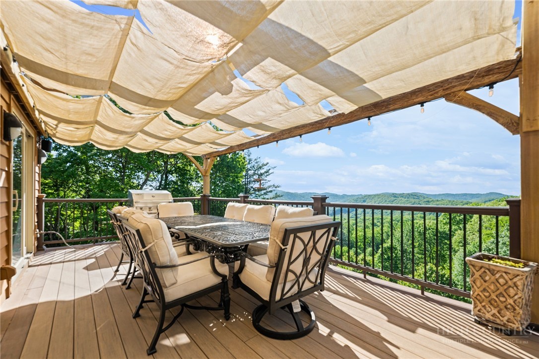 331 Alpine Road Blowing Rock, NC 28605 - Photo 5 of 50 a table and chairs in front of a house