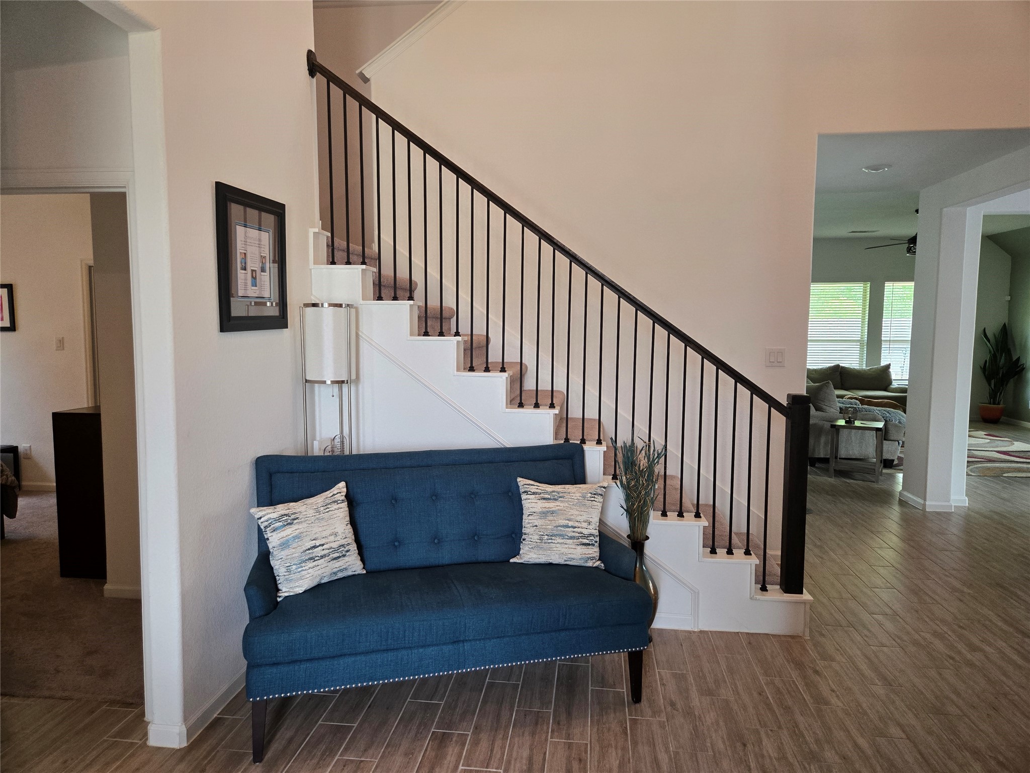 5035 Sierra Ridge Drive Rosenberg, TX 77469 - Photo 3 of 26 Step into elegance with a welcoming entryway featuring a stylish staircase leading to the upper story, setting the tone for a warm and inviting home.