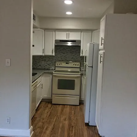 a kitchen with a stove and a refrigerator