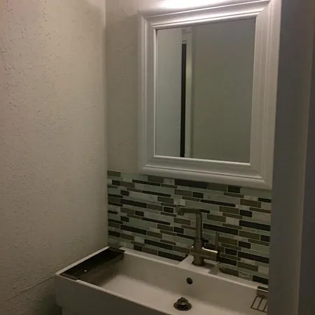 a bathroom with a sink and a window