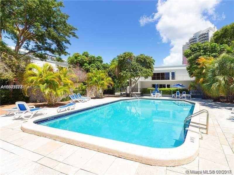210 Seaview Drive, Unit 607 Key Biscayne, FL 33149 - Photo 4 of 4 a view of swimming pool with outdoor seating