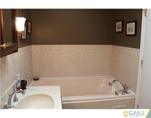 295 Marshall Road North Brunswick, NJ 08902 - Photo 12 of 19 a bathroom with a bathtub