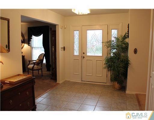 295 Marshall Road North Brunswick, NJ 08902 - Photo 3 of 19 a living room with furniture and a potted plant