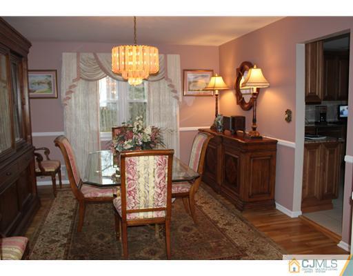 295 Marshall Road North Brunswick, NJ 08902 - Photo 5 of 19 a view of a dining room with furniture and a window