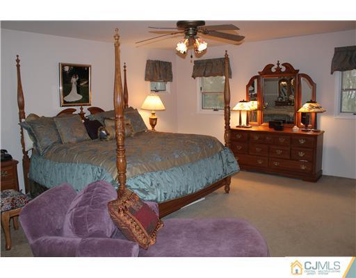 295 Marshall Road North Brunswick, NJ 08902 - Photo 10 of 19 a bedroom with a bed window and dresser