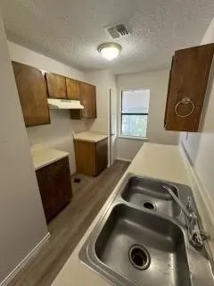 a utility room with sink dryer and washer
