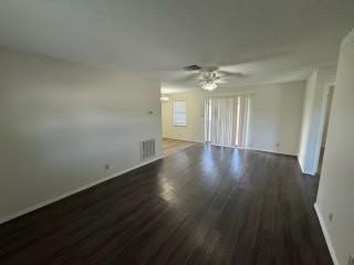 1870 King David Drive, Unit 206 Three Rivers, TX 78071 - Photo 3 of 5 a view of an empty room with wooden floor and a window