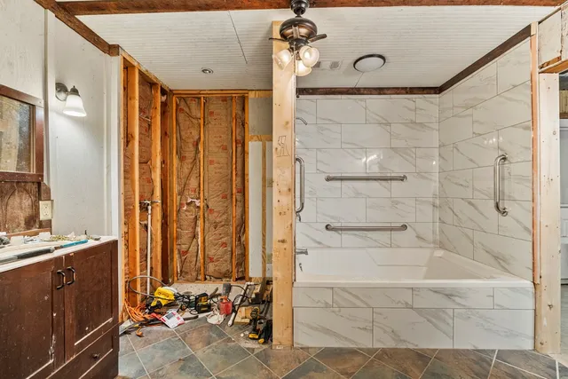 a view of a bathroom with a shower and a sink