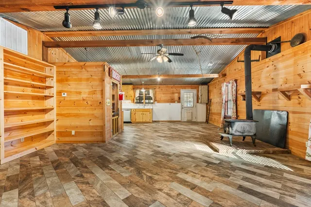 a view of a room with wooden floor