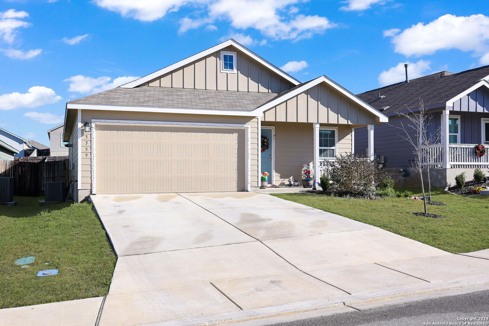 5359 Forbs Lane Bulverde, TX 78163 - Photo 15 of 21 a front view of a house with a yard and garage