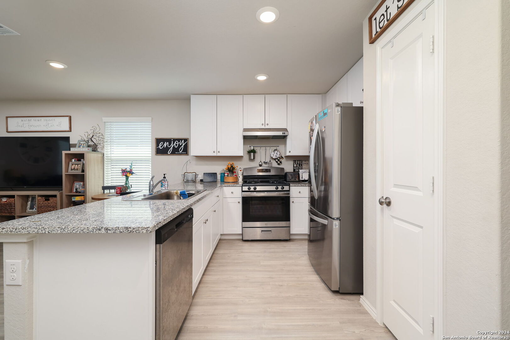 5359 Forbs Lane Bulverde, TX 78163 - Photo 4 of 21 a large kitchen with a stove top oven a refrigerator and a sink