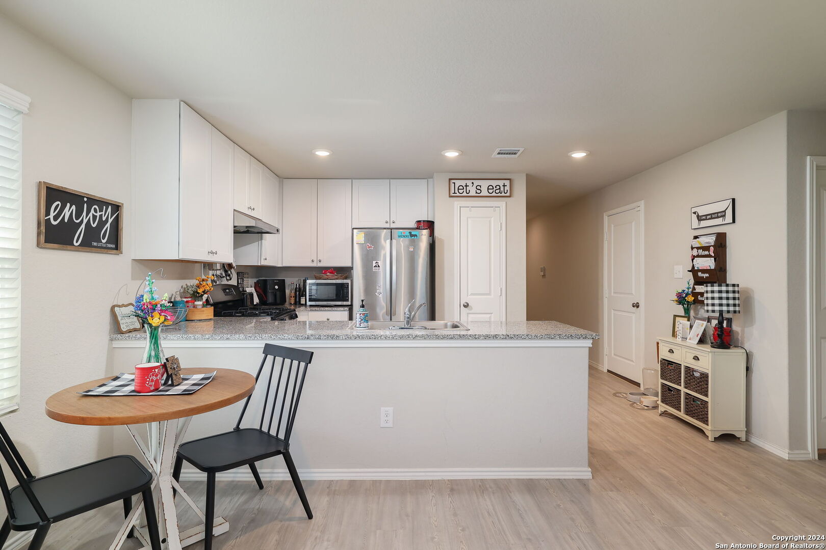 5359 Forbs Lane Bulverde, TX 78163 - Photo 5 of 21 a living room with stainless steel appliances furniture a dining table and chairs