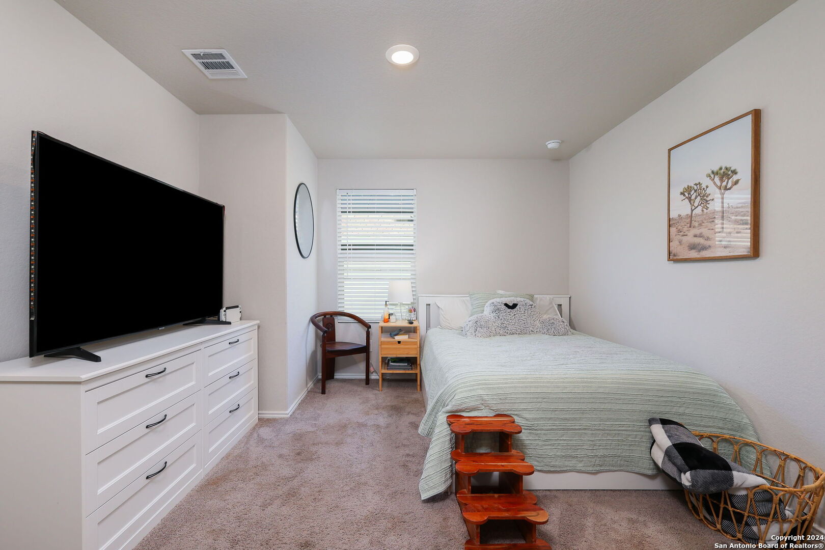 5359 Forbs Lane Bulverde, TX 78163 - Photo 10 of 21 a bedroom with furniture and a flat screen tv