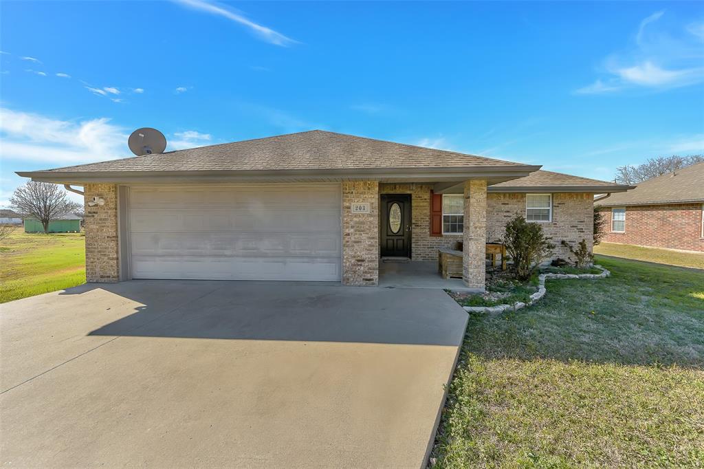 203 North Church Street Blue Ridge, TX 75424 - Photo 2 of 18 a front view of a house with garden