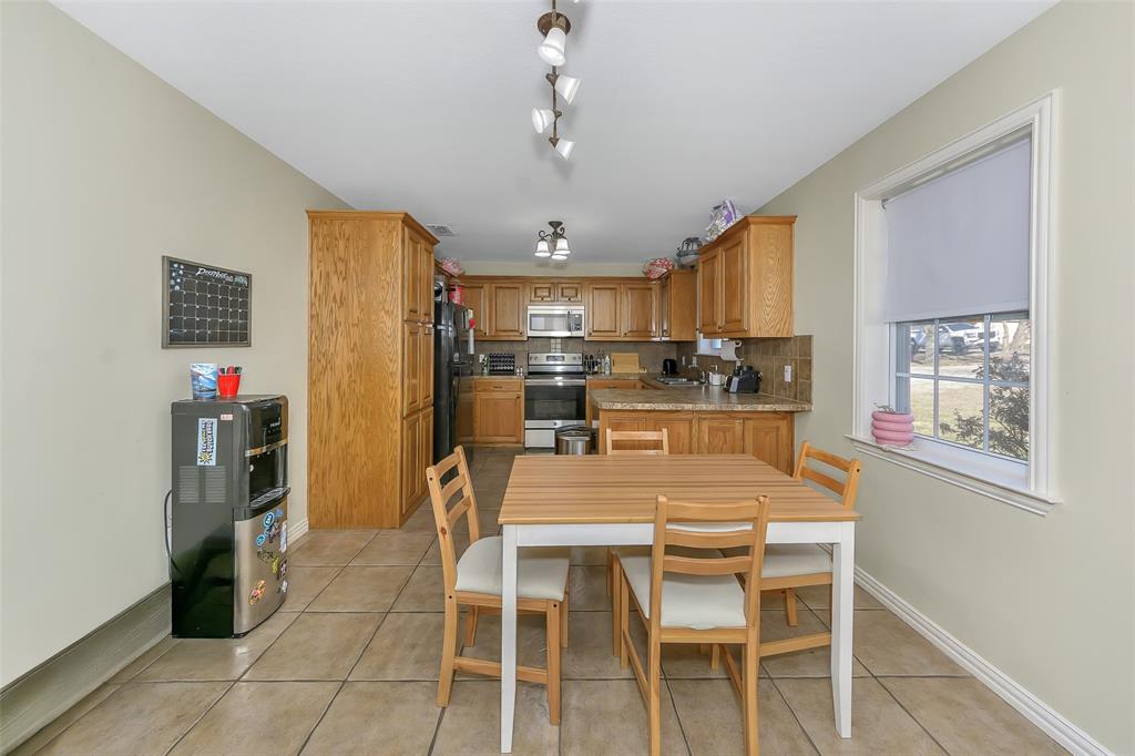203 North Church Street Blue Ridge, TX 75424 - Photo 3 of 18 a view of a dining room with furniture and a chandelier