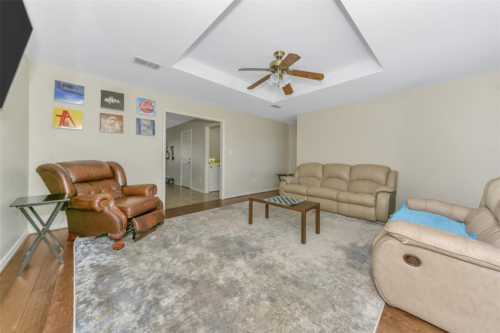 203 North Church Street Blue Ridge, TX 75424 - Photo 9 of 18 a living room with furniture and a gym cycle