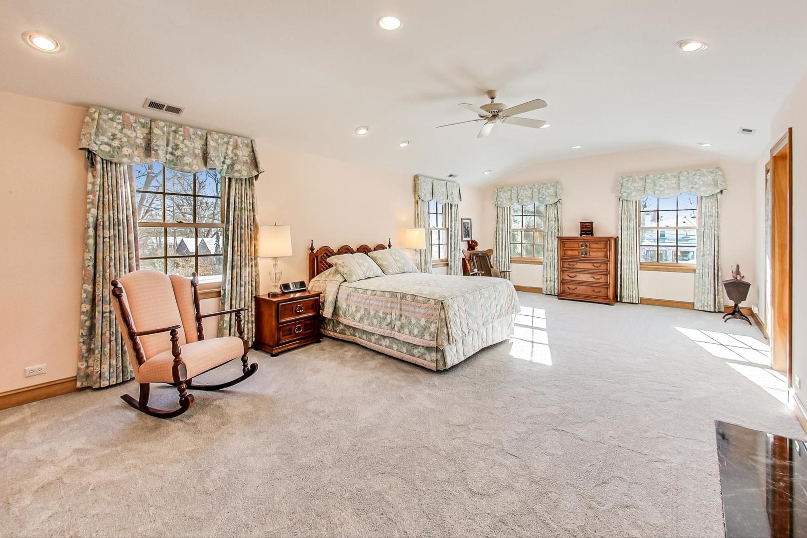 1166 Cherry Street Winnetka, IL 60093 - Photo 22 of 44 a living room with furniture and a chandelier