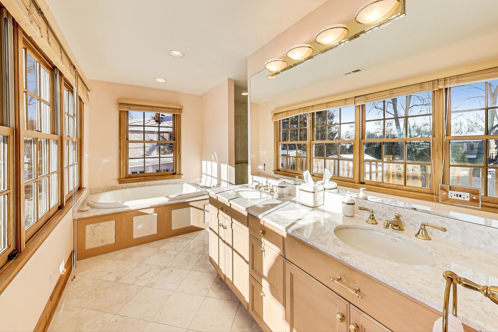 1166 Cherry Street Winnetka, IL 60093 - Photo 26 of 44 a large white kitchen with a large window