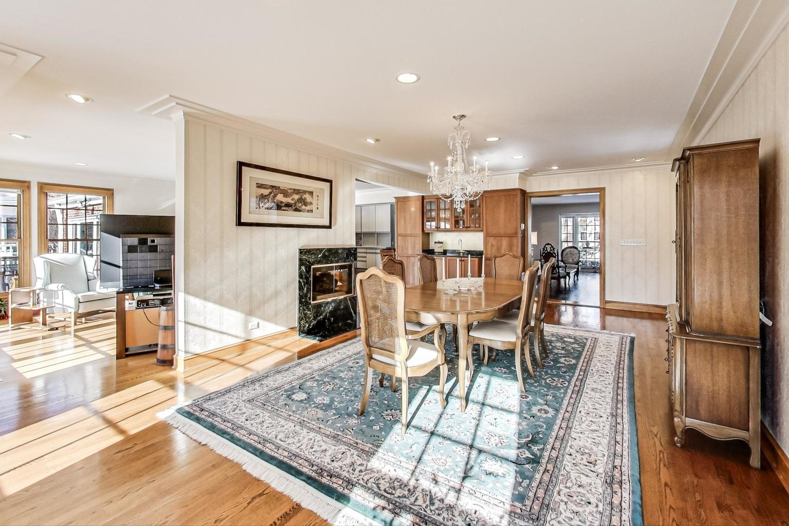 1166 Cherry Street Winnetka, IL 60093 - Photo 9 of 44 a dining room with furniture and wooden floor