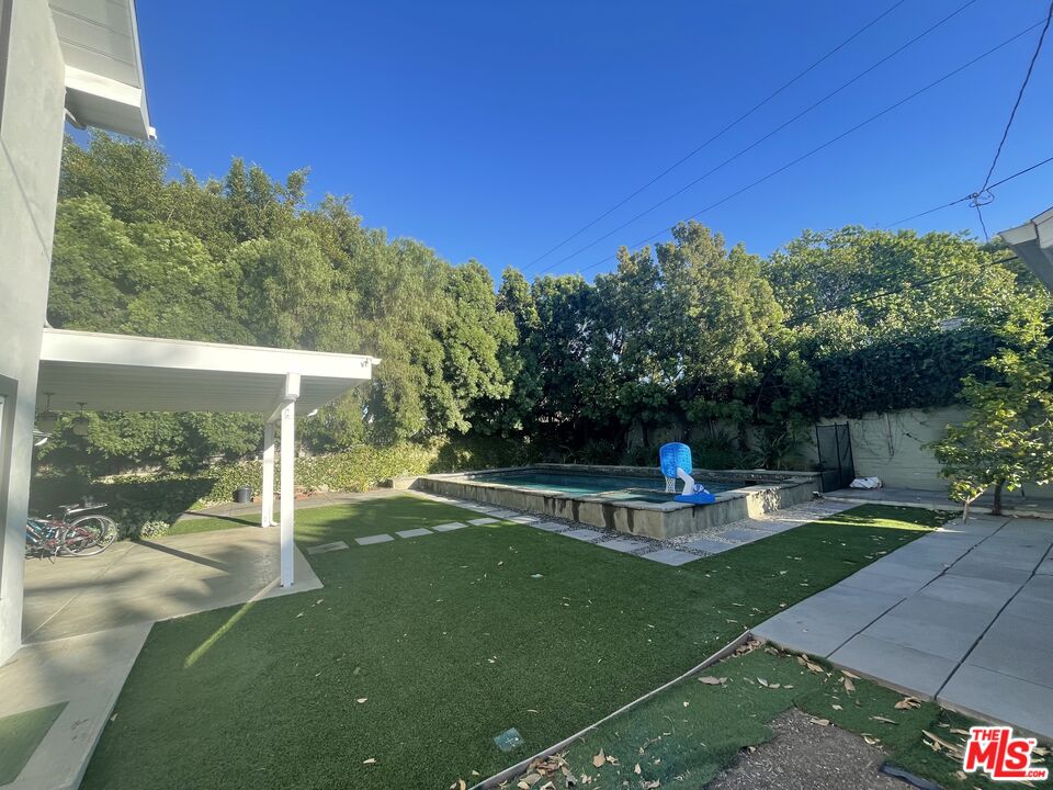 9500 Cresta Drive Los Angeles, CA 90035 - Photo 12 of 13 a view of a swimming pool with a patio