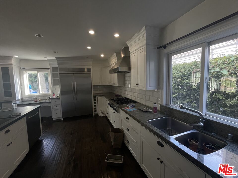 9500 Cresta Drive Los Angeles, CA 90035 - Photo 7 of 13 a kitchen that has a sink and a stove top oven