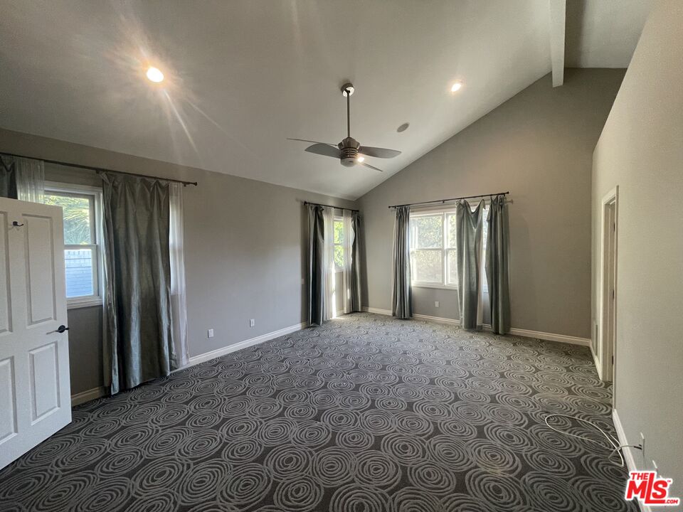 9500 Cresta Drive Los Angeles, CA 90035 - Photo 8 of 13 a view of a hallway with a chandelier
