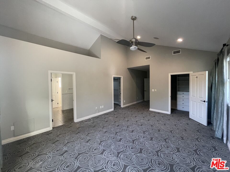 9500 Cresta Drive Los Angeles, CA 90035 - Photo 9 of 13 an empty room with closet and a ceiling fan