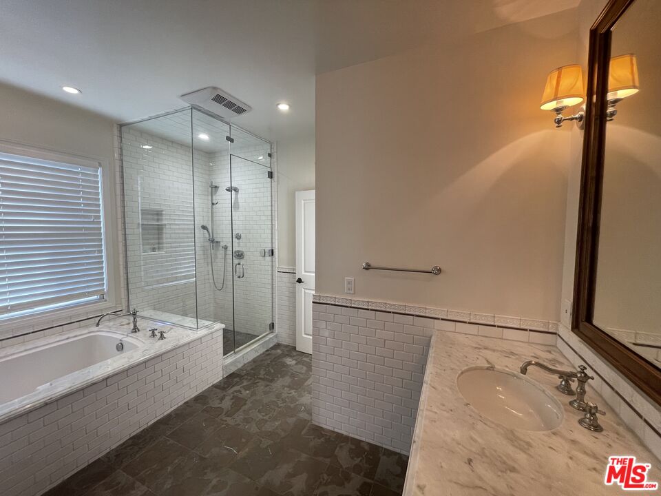 9500 Cresta Drive Los Angeles, CA 90035 - Photo 10 of 13 a bathroom with a bathtub and a shower