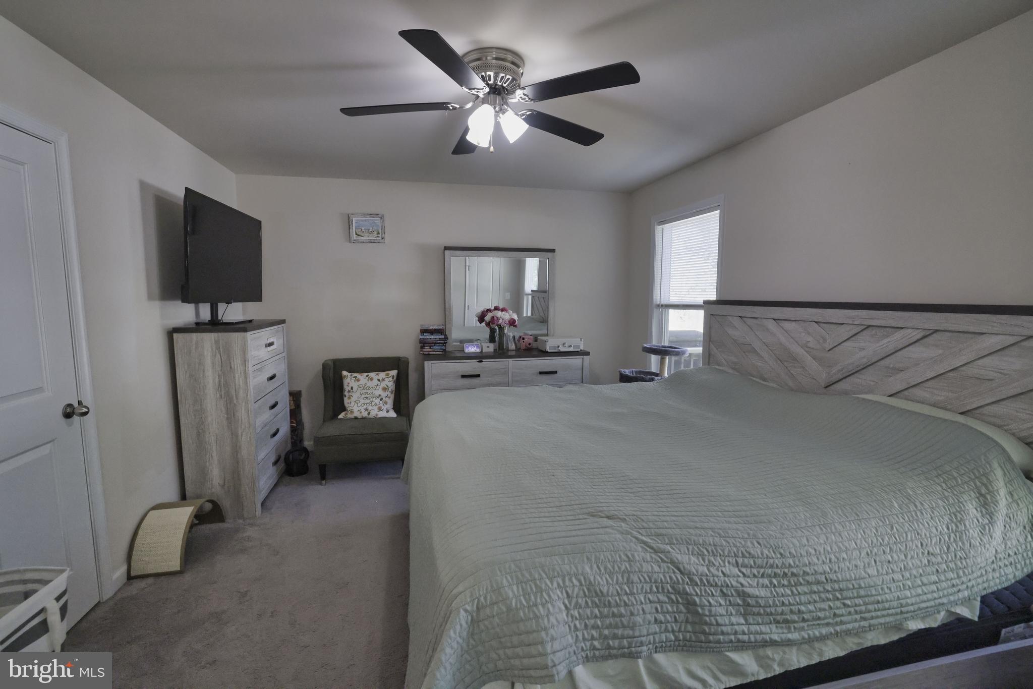 48 Rustic Lane Colonial Beach, VA 22443 - Photo 35 of 47 a bed room with furniture and a flat screen tv