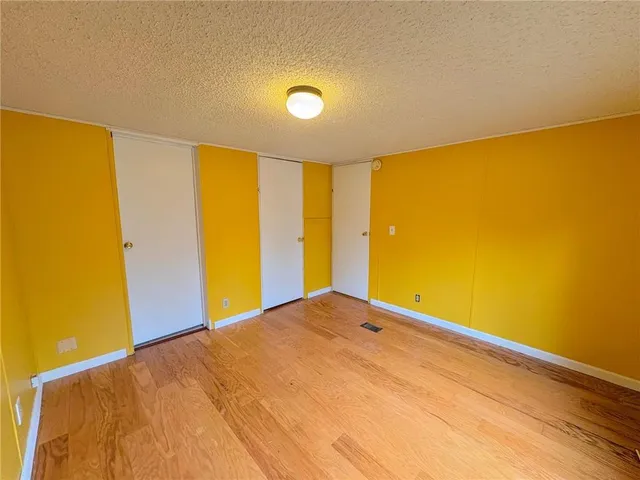 a view of big room with wooden floor