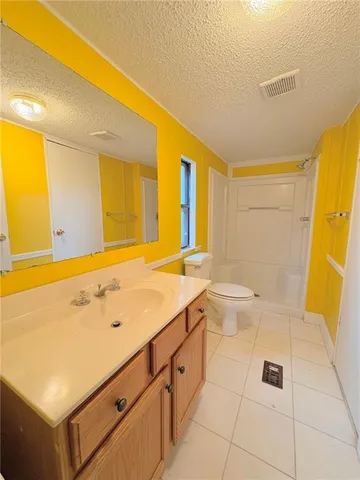 a bathroom with a sink a toilet and a tub