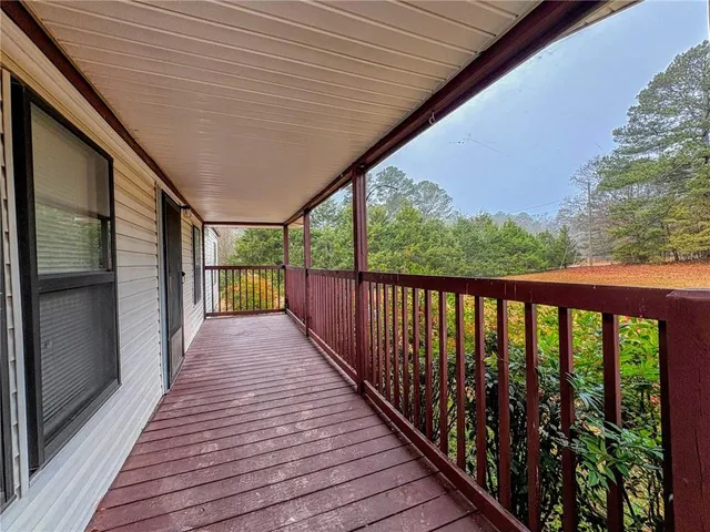 a view of balcony with wooden floor