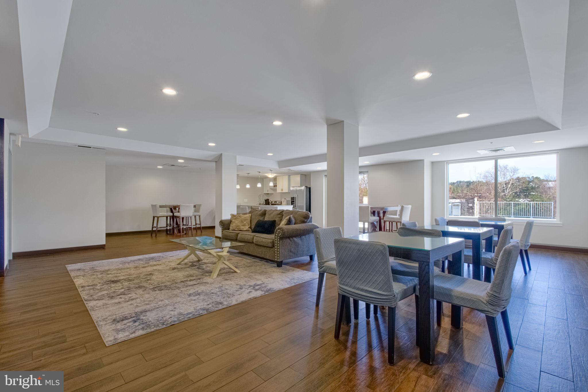 6301 Edsall Road, Unit 418 Alexandria, VA 22312 - Photo 11 of 44 a view of a dining room with furniture window and wooden floor