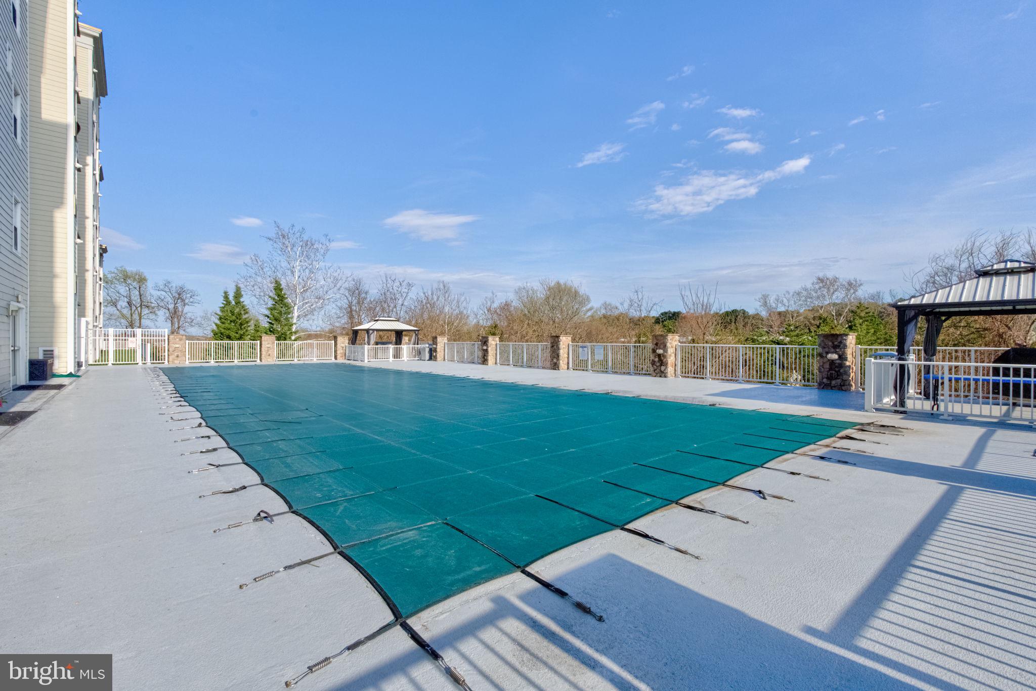 6301 Edsall Road, Unit 418 Alexandria, VA 22312 - Photo 42 of 44 a view of a patio with a yard