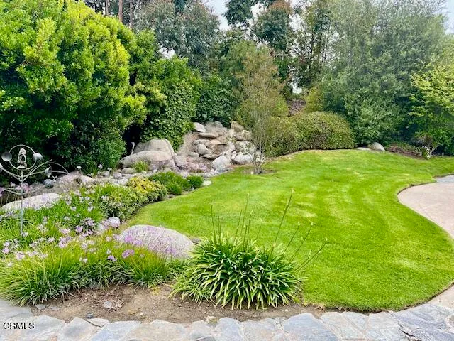 a large living room with furniture and a fireplace