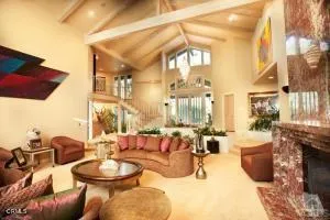 a view of a living room and kitchen with furniture