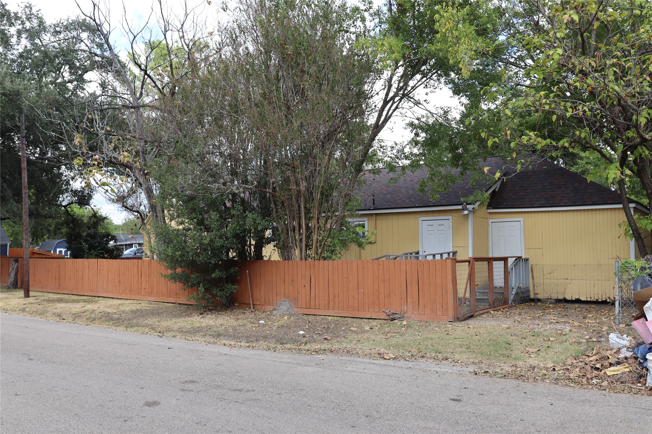 4302 Delhi Street Houston, TX 77022 - Photo 2 of 23 front view of a house with a yard and an trees