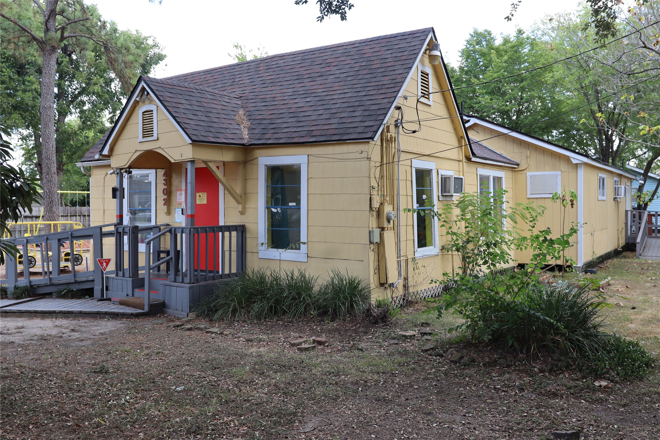 4302 Delhi Street Houston, TX 77022 - Photo 22 of 23 front view of a house with a small yard