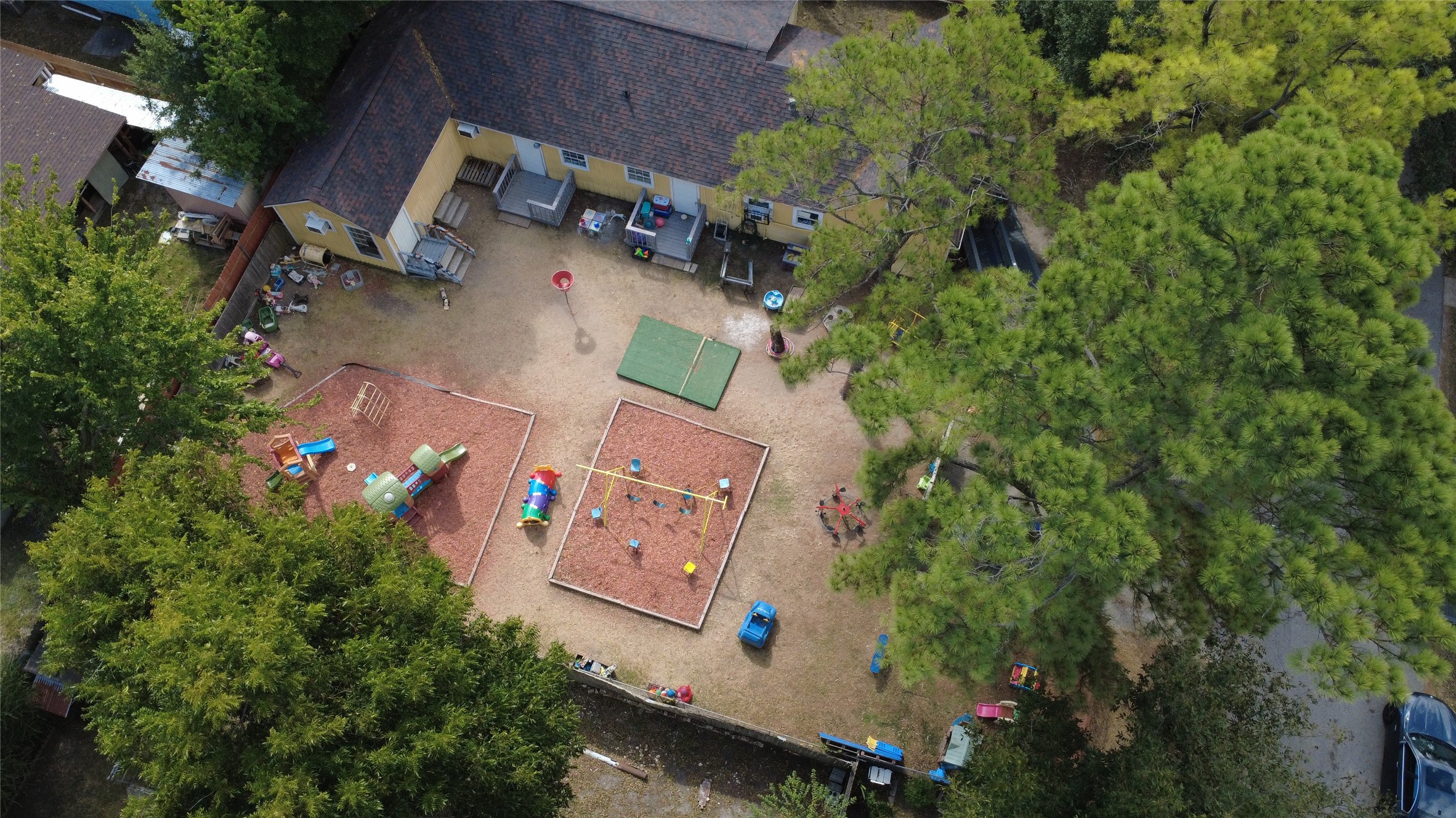4302 Delhi Street Houston, TX 77022 - Photo 4 of 23 an aerial view of residential house with outdoor space and trees all around