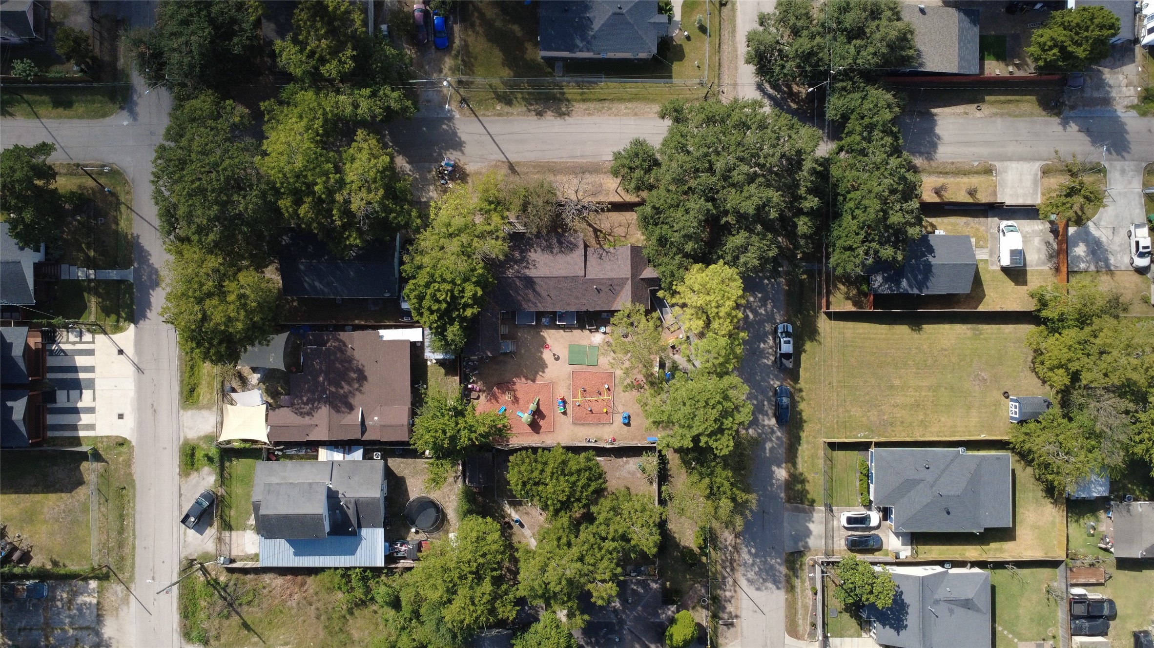 4302 Delhi Street Houston, TX 77022 - Photo 9 of 23 an aerial view of a house with a garden and lake view