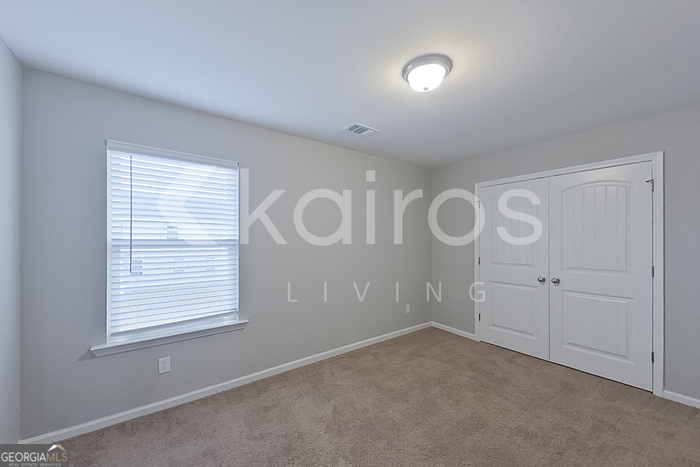 101 St Phillip Way Springfield, GA 31329 - Photo 13 of 25 a view of an empty room with a window