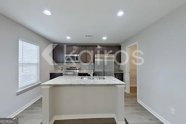 a large kitchen with a large window