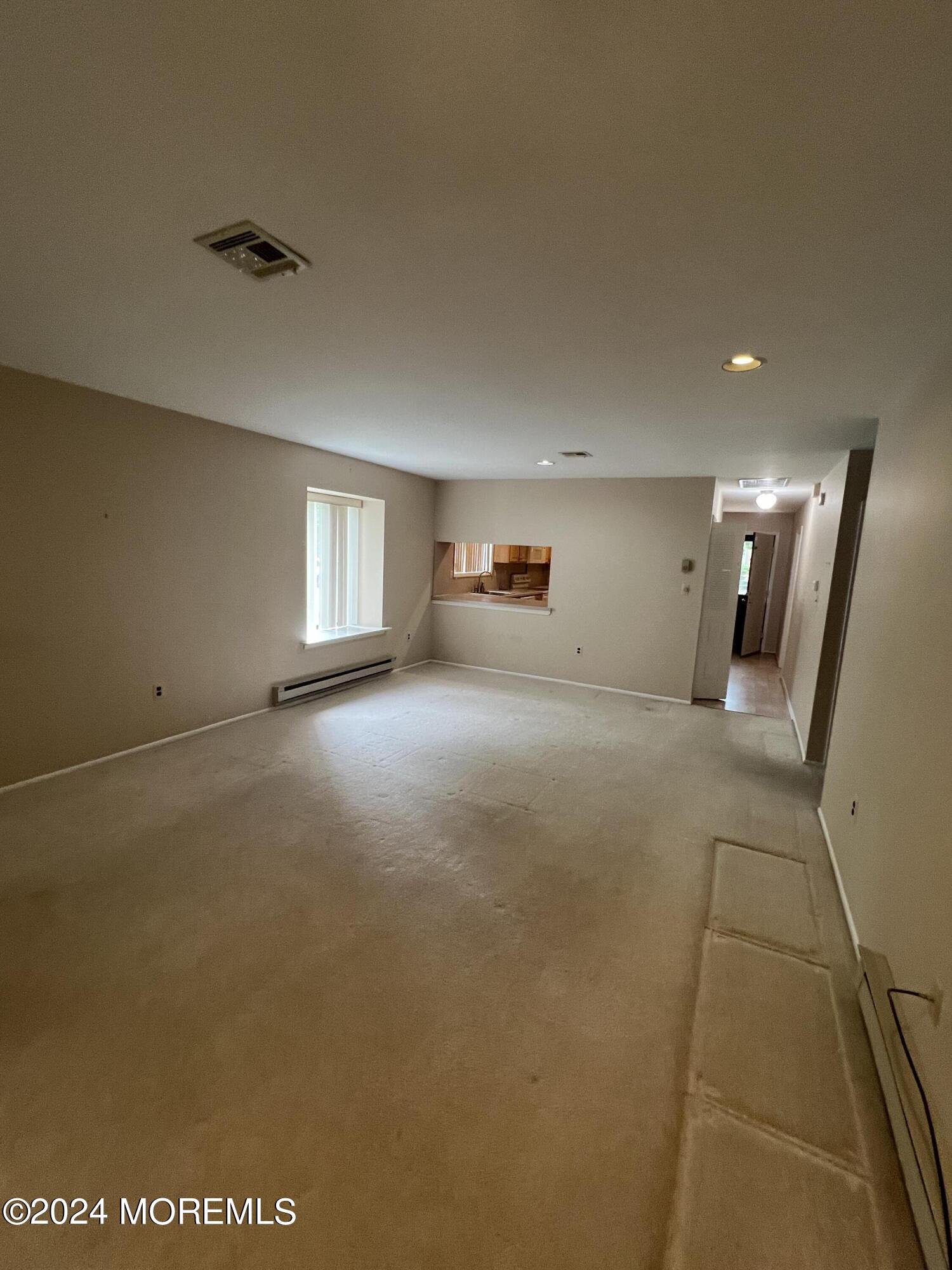 222 Medford Court, Unit E Englishtown, NJ 07726 - Photo 4 of 11 Living Room Dining Combo