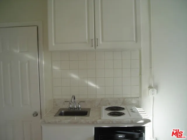 a bathroom with a sink and vanity