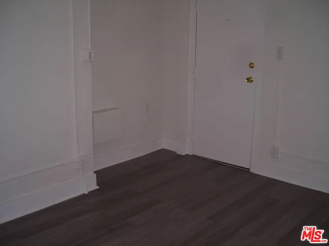 a view of a small space with wooden floor
