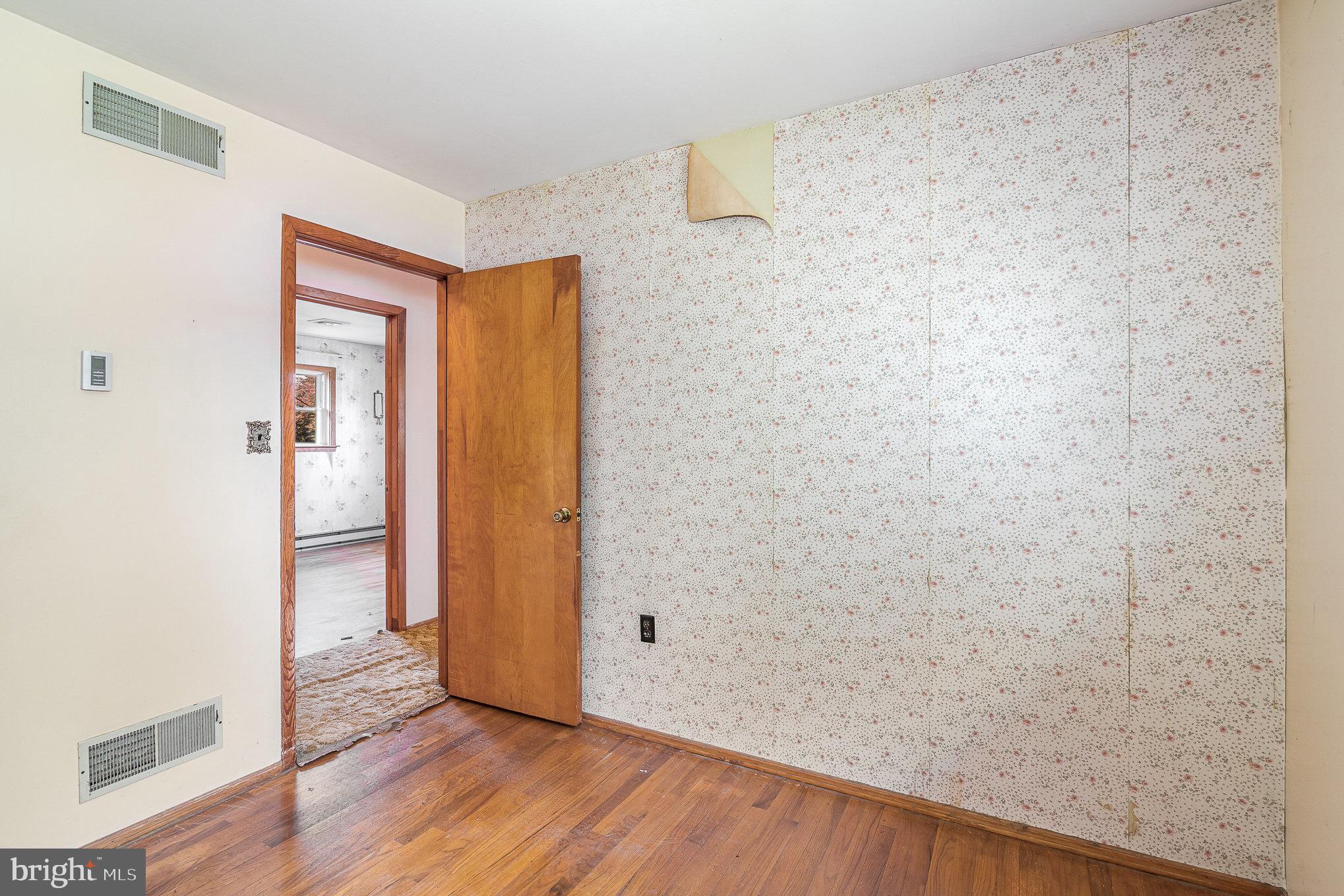 1955 Dawn Road Enola, PA 17025 - Photo 12 of 21 a view of an empty room with wooden floor and a window