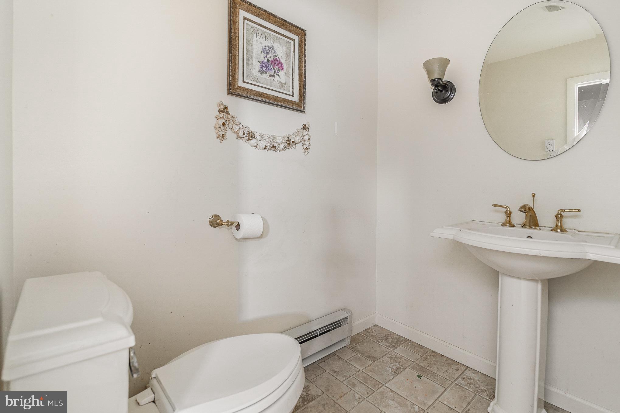 1955 Dawn Road Enola, PA 17025 - Photo 4 of 21 a bathroom with a toilet sink and mirror