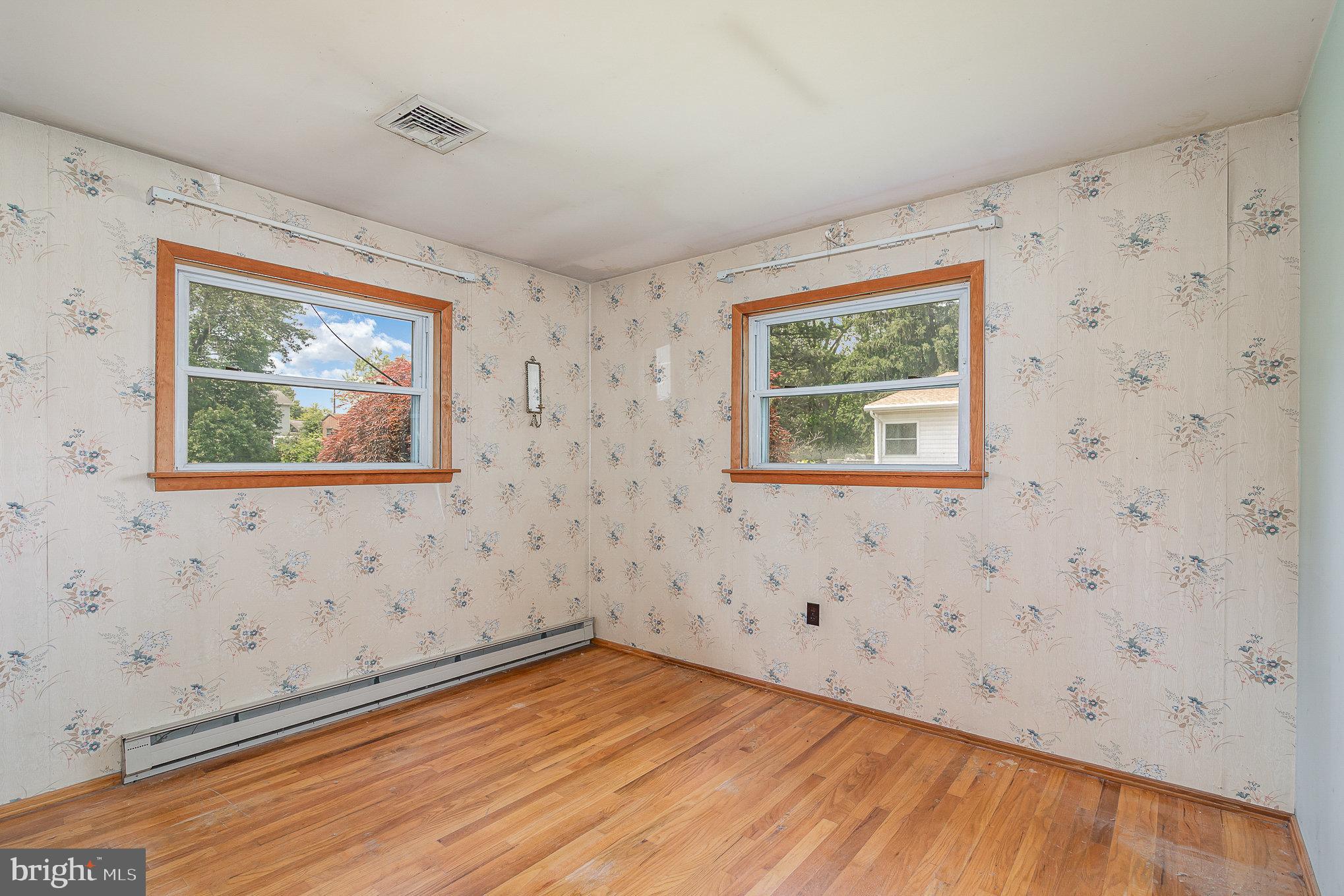 1955 Dawn Road Enola, PA 17025 - Photo 8 of 21 an empty room with wooden floor and windows
