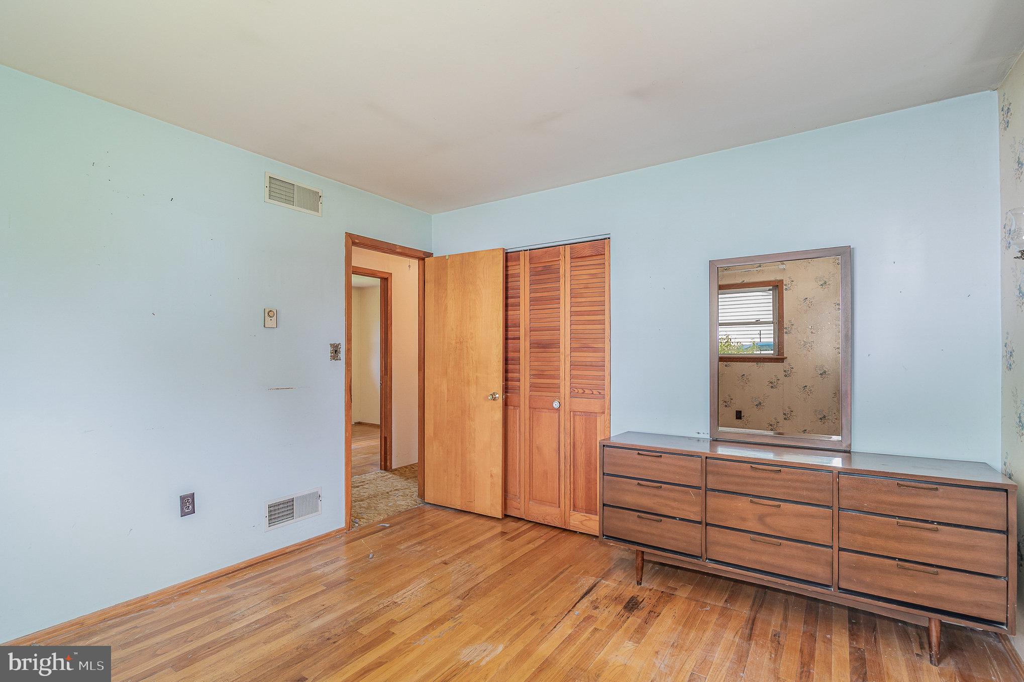 1955 Dawn Road Enola, PA 17025 - Photo 9 of 21 an empty room with wooden floor and cabinet